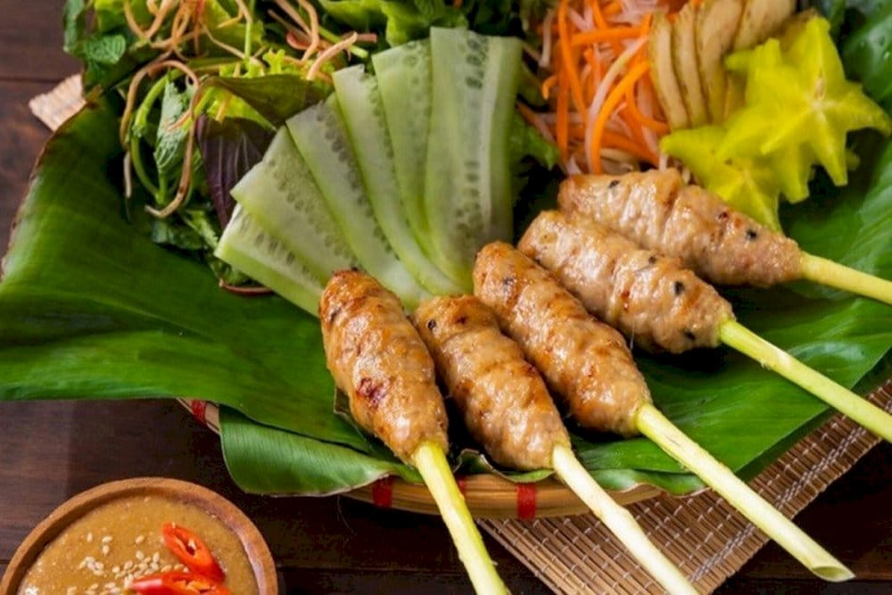 Nem lui is grilled over charcoal for an aromatic taste, paired with rice paper and fresh herbs for a memorable dish